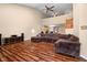 Spacious living room with high ceilings, hardwood floors, and comfortable brown sectional sofa at 4916 Franklin Villas Dr, Indianapolis, IN 46237