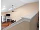 View from the upper stairs showcases an open concept living room with a fireplace and lots of natural light at 4916 Franklin Villas Dr, Indianapolis, IN 46237