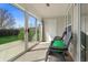 Enclosed sunroom with sliding glass doors providing access to the outdoors and ample sunlight at 4916 Franklin Villas Dr, Indianapolis, IN 46237