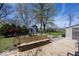 Backyard featuring a wooden bench, a barn, a gazebo, a shed, and mature trees at 506 N County Road 900 E, Avon, IN 46123