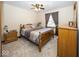 Bedroom featuring a full sized bed and a window with neutral curtains at 506 N County Road 900 E, Avon, IN 46123