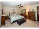 Bedroom featuring a queen sized bed, wooden furniture, and a ceiling fan at 506 N County Road 900 E, Avon, IN 46123