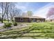 Charming brick home with well-maintained lawn and mature trees at 506 N County Road 900 E, Avon, IN 46123