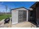Gray outdoor storage shed on a wooden deck in a green backyard at 506 N County Road 900 E, Avon, IN 46123
