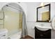 Cozy bathroom features a vanity with vessel sink, a framed mirror, and a shower and tub combo at 516 S 10Th St, Noblesville, IN 46060
