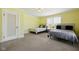 Spacious bedroom featuring carpeted floors and two comfortable beds with bright, natural light at 516 S 10Th St, Noblesville, IN 46060