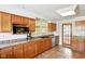 Traditional kitchen featuring granite counters, wood cabinets, and stainless steel appliances at 516 S 10Th St, Noblesville, IN 46060