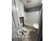 Updated bathroom featuring a white vanity, toilet, and shower-tub combo at 517 Dicks St, Lebanon, IN 46052