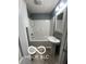 Updated bathroom featuring a pedestal sink, toilet, and shower-tub combo at 517 Dicks St, Lebanon, IN 46052
