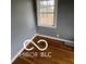 Bedroom featuring wood floors and natural light at 517 Dicks St, Lebanon, IN 46052