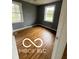 Bedroom featuring bright windows, hardwood floors, and natural light at 517 Dicks St, Lebanon, IN 46052