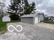 Detached garage with white door and gray siding at 517 Dicks St, Lebanon, IN 46052