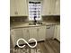 Well-equipped kitchen featuring stainless steel sink and wood-look floors at 517 Dicks St, Lebanon, IN 46052