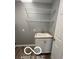 Functional laundry room showcasing sink with wire shelves at 517 Dicks St, Lebanon, IN 46052