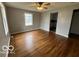 Sunlit living room featuring hardwood floors and fresh paint, ready for your personal touch at 517 Dicks St, Lebanon, IN 46052