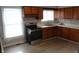 Bright kitchen featuring stainless steel appliances, and wooden cabinetry at 548 S Vine St, Indianapolis, IN 46241