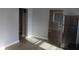 Modern kitchen space featuring stainless steel refrigerator, cabinets and wood-look floors at 548 S Vine St, Indianapolis, IN 46241