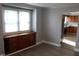 Cozy living room with a vintage cabinet and a large window providing plenty of natural light at 548 S Vine St, Indianapolis, IN 46241