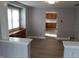 Open-concept living room leading to the kitchen, featuring modern wood-look flooring at 548 S Vine St, Indianapolis, IN 46241