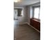 Living room boasts hardwood-style floors, built-in cabinet and lots of natural light at 548 S Vine St, Indianapolis, IN 46241