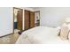 Bright bedroom with a modern style, a glimpse of the bathroom, and a comfortable retreat at 5634 Wynridge Ct, Indianapolis, IN 46235