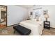 Comfortable bedroom with neutral walls, plush carpet, and a view into the living room, creating an open feel at 5634 Wynridge Ct, Indianapolis, IN 46235