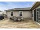 Large outdoor deck with a dining set, grill, and views of the home's exterior at 5634 Wynridge Ct, Indianapolis, IN 46235