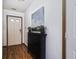 Cozy entryway featuring hardwood floors, neutral walls, shoe storage and a white front door at 5634 Wynridge Ct, Indianapolis, IN 46235