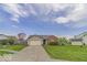 Traditional single-story home featuring a brick facade, attached garage, and well-manicured lawn at 5634 Wynridge Ct, Indianapolis, IN 46235