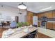 Bright kitchen and dining area boasts stainless steel appliances, ample cabinet space, and opens to a living room at 5634 Wynridge Ct, Indianapolis, IN 46235