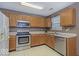 This modern kitchen has stainless steel appliances, ample counter space, and neutral color palette at 5634 Wynridge Ct, Indianapolis, IN 46235