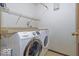 Functional laundry room with a modern, front-loading washer and dryer set at 5634 Wynridge Ct, Indianapolis, IN 46235