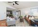 Inviting living room with stylish furnishings, a ceiling fan, and access to the dining area at 5634 Wynridge Ct, Indianapolis, IN 46235