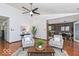 Bright living room featuring hardwood floors and neutral-colored walls with views to the dining and entry at 5634 Wynridge Ct, Indianapolis, IN 46235