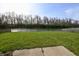 Spacious backyard with a patio overlooking the pond at 5828 Long Lake Ln, Indianapolis, IN 46235