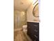 Bathroom featuring modern vanity, shower, and sleek fixtures at 5828 Long Lake Ln, Indianapolis, IN 46235