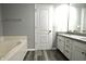 Bathroom featuring a tub, vanity, and tile flooring at 5828 Long Lake Ln, Indianapolis, IN 46235
