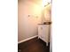Bathroom with white vanity, dark countertop and hardwood style floor at 5828 Long Lake Ln, Indianapolis, IN 46235