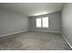 Bright bedroom featuring neutral walls, plush carpeting, and lots of natural light at 5828 Long Lake Ln, Indianapolis, IN 46235