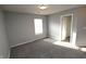 Carpeted bedroom with natural light, neutral walls, and a closet at 5828 Long Lake Ln, Indianapolis, IN 46235