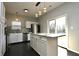 Bright kitchen with a granite island and stainless steel appliances at 5828 Long Lake Ln, Indianapolis, IN 46235