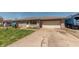 Charming single-story home with stone facade, attached garage, and well-maintained front yard at 594 Daugherty St, Columbus, IN 47201