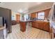 Functional kitchen with vintage charm, featuring wood cabinetry and an adjacent dining area at 594 Daugherty St, Columbus, IN 47201