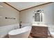 Bright bathroom featuring a modern tub, sleek vanity, and neutral decor for a relaxing space at 611 Victor Pl, Shelbyville, IN 46176