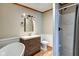 Bathroom features a shower and vanity with wooden cabinets at 611 Victor Pl, Shelbyville, IN 46176