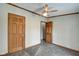 Bedroom with wood trim, closet space, and doorways at 611 Victor Pl, Shelbyville, IN 46176
