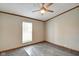 Bedroom with new gray carpet and natural light from the window at 611 Victor Pl, Shelbyville, IN 46176
