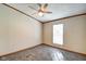 Simple bedroom with a ceiling fan and natural light from the window at 611 Victor Pl, Shelbyville, IN 46176