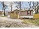Charming single-story home featuring a cozy front porch and well-maintained exterior with red shutters at 611 Victor Pl, Shelbyville, IN 46176