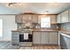 Updated kitchen features stainless steel appliances and stylish cabinets at 611 Victor Pl, Shelbyville, IN 46176